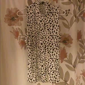 Leopard print sleeveless mock neck express shirt.